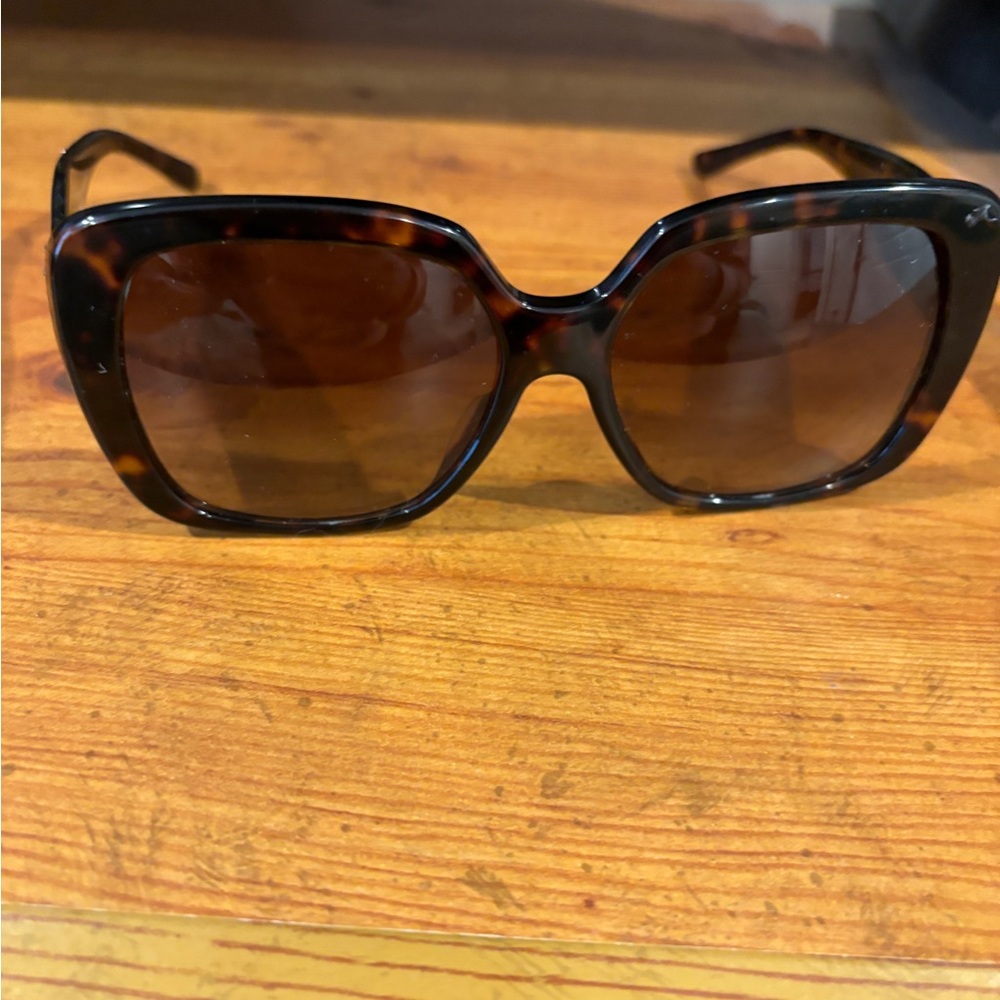 Tory Burch sunglasses , like new . They dont fit the size of my face that well